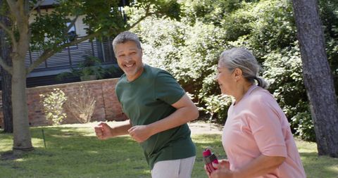 Seniors Enjoying a Refreshing Run in Nature
