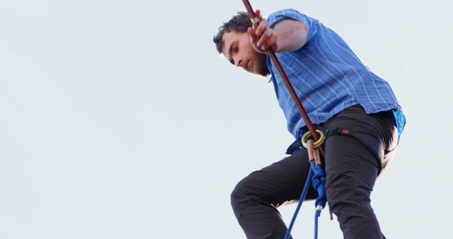 Male Embracing Adventure While Engaging in Rock Climbing Activity - Download Free Stock Images Pikwizard.com