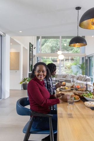 African american couple sharing cozy brunch at modern open-plan kitchen counter