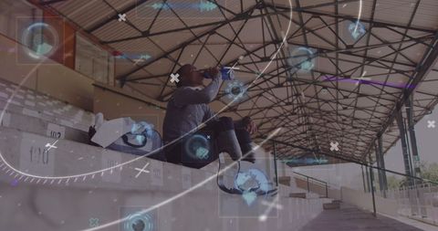 Disabled Athlete Hydrating Amid Digital Interface