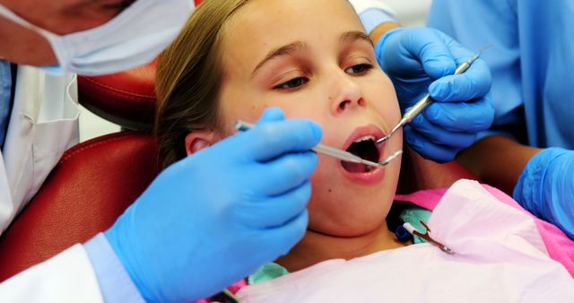 Child Dentist Examination with Two Professionals Using Tools - Download Free Stock Images Pikwizard.com