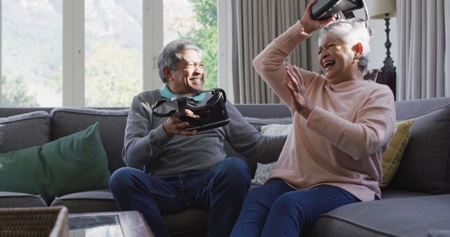 Senior Couple Enjoying Virtual Reality Gaming on Couch - Download Free Stock Images Pikwizard.com