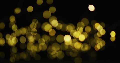 Glowing Yellow Bokeh Lights on Dark Background - Download Free Stock Images Pikwizard.com