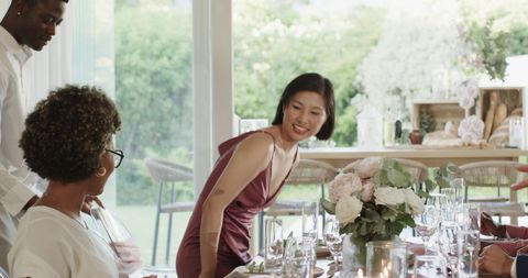 Festive Dining Gathering at Wedding Celebration with Friends