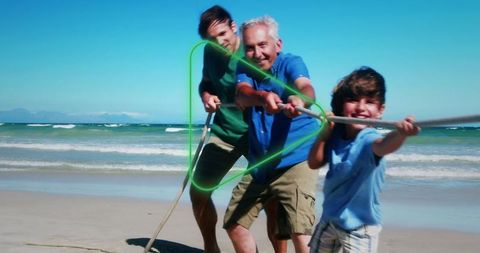Multigenerational Family Enjoying Beach Tug-of-War