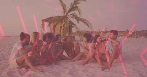 Friends Celebrating Sunset with Drinks on Beach