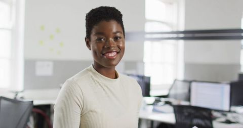 Confident African American Businesswoman Reviewing Documents in Modern Office