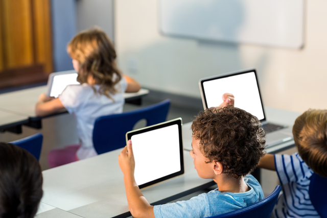 Young Students Using Tablets in Modern Classroom, Transparent Devices - Download Free Stock Videos Pikwizard.com