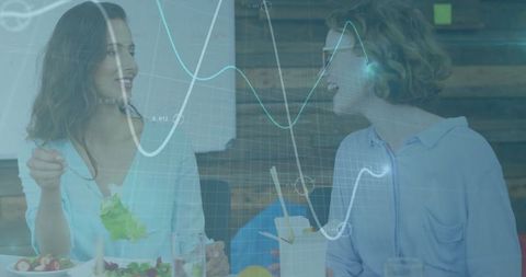 Colleagues enjoying healthy lunch in office break area