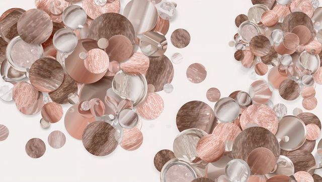 Layering rose-gold metallic, wood and glass circles creating abstract elegant backdrop