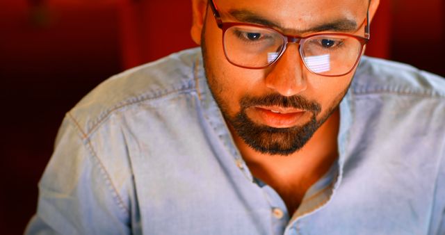 Focused Man in Glasses Working on Laptop at Night - Download Free Stock Images Pikwizard.com