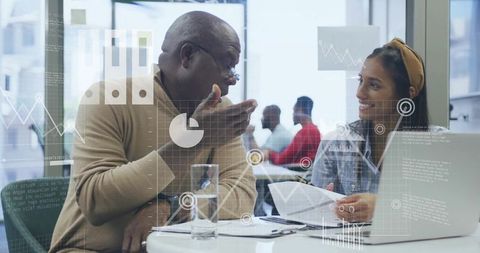 Consultants Collaborating Reviewing Data with Modern Visuals