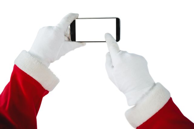 Santa Claus hands using a smartphone, perfect for holiday-themed technology advertisements, Christmas promotions, festive greeting cards, and digital communication campaigns. Highlights the blend of traditional holiday imagery with modern technology.