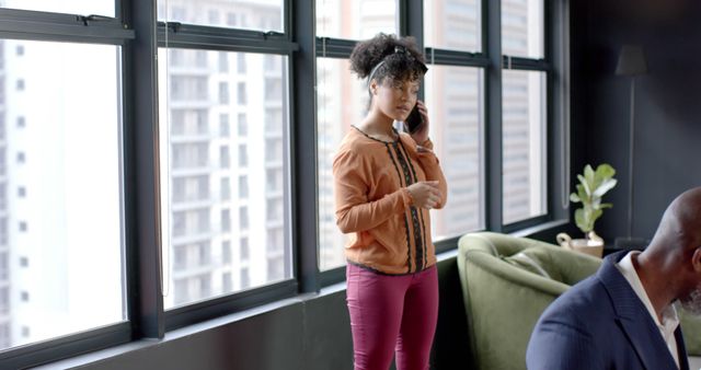 Businesswoman Taking Phone Call by Office Window - Download Free Stock Images Pikwizard.com