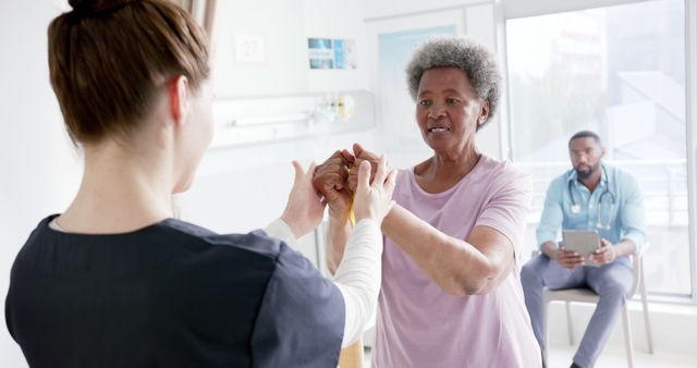 Elderly Woman Undergoing Rehabilitation with Therapist in Clinic - Download Free Stock Images Pikwizard.com