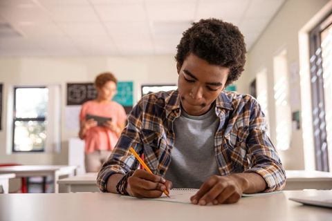 Student Focused on Learning at Classroom Desk