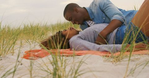Romantic African American Couple Relaxing on Sandy Beach - Download Free Stock Images Pikwizard.com