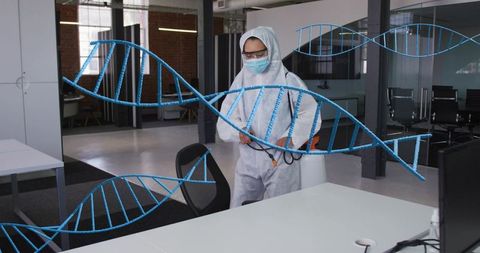 Disinfecting loft office wearing full ppe backpack sprayer with blue dna helix overlay