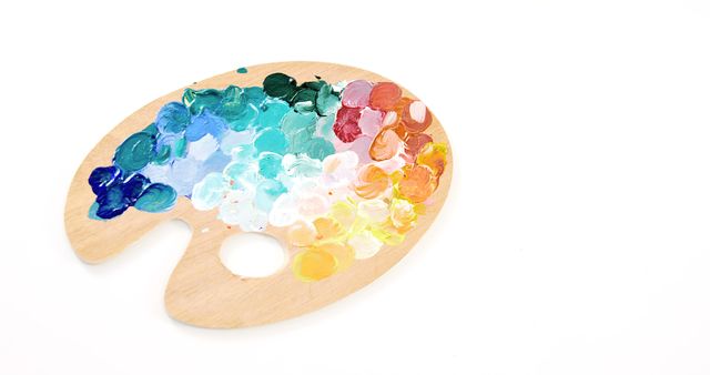 Wooden Palette with Multicolored Paint against White Background - Download Free Stock Photos Pikwizard.com