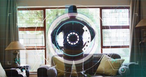 Man standing facing window with augmented reality hud overlay in living room interior