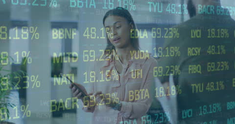 Businesswoman Analyzing Stock Market Data Using Tablet