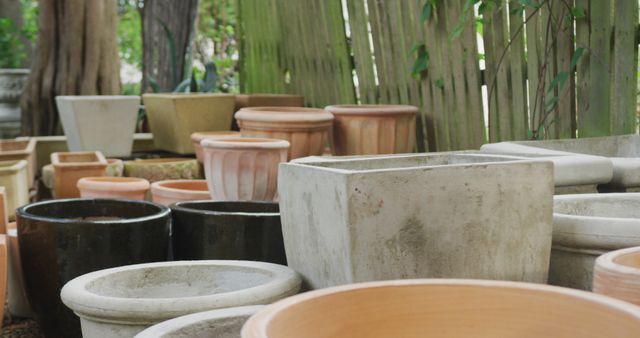 Close up of multiple empty flowerpots in garden. Spending time outdoors, working in garden nursery.