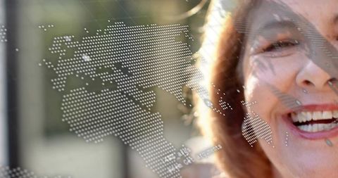 Smiling senior woman with dotted world map overlay suggesting global connection and optimism