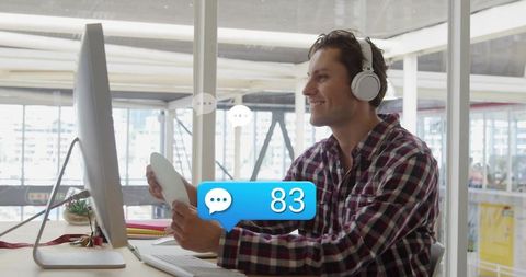 Professionalman engaging with digital communication at work desk