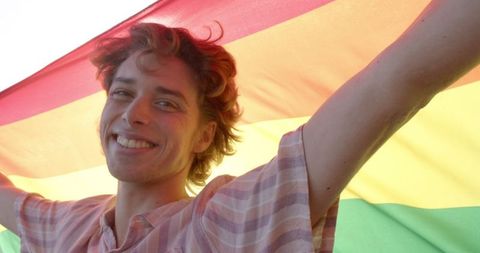 Joyful Man Celebrating with Rainbow LGBT Flag - Download Free Stock Images Pikwizard.com
