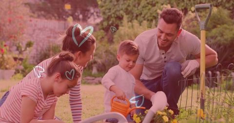 Happy family gardening together in backyard fun activity