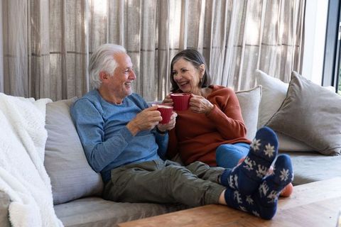 Happy Senior Couple Enjoying Relaxing Coffee Moment at Home