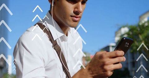 Man Using Smartphone with Arrows Overlay in City