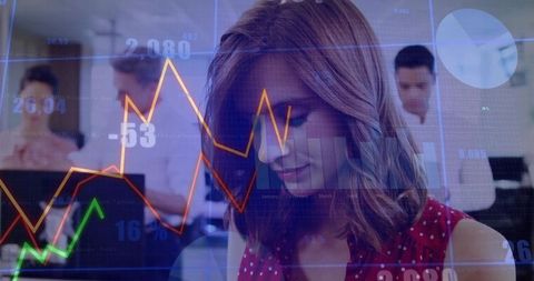 Businesswoman Analyzing Financial Data in Tech-Savvy Office