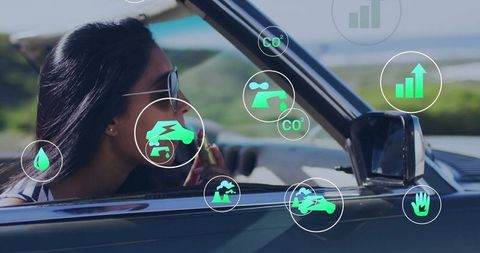 Woman traveling in convertible with digital eco icons