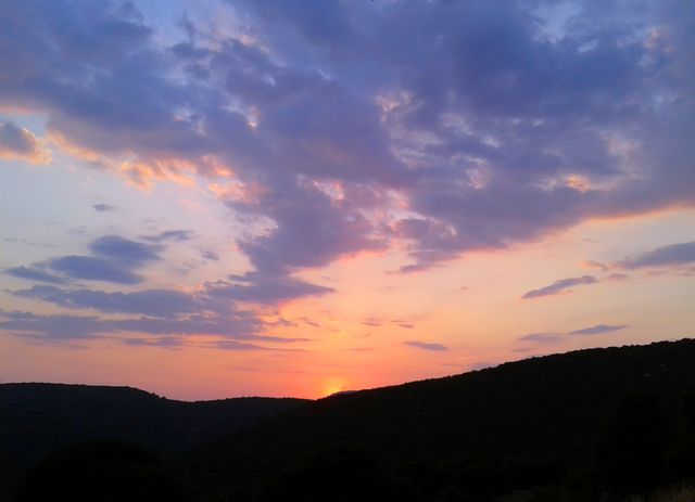 Scenic Sunset over Rolling Hills with Clouds - Download Free Stock Photos Pikwizard.com