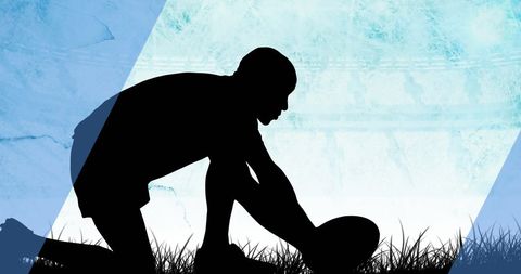 Silhouetted Rugby Player with Ball on Grassy Field Background - Download Free Stock Images Pikwizard.com