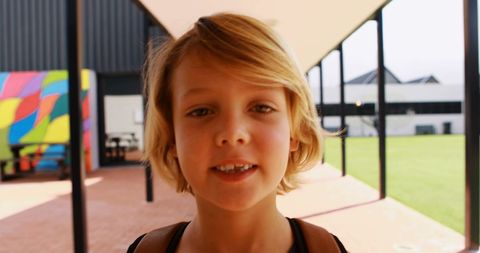 Happy Young Boy Smiling at School Campus