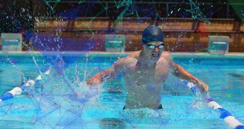 Adult male swimmer in action during pool competition