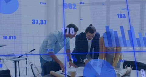 Team Collaborating Over Blueprint with Financial Charts and Data Overlay in Bright Modern Office