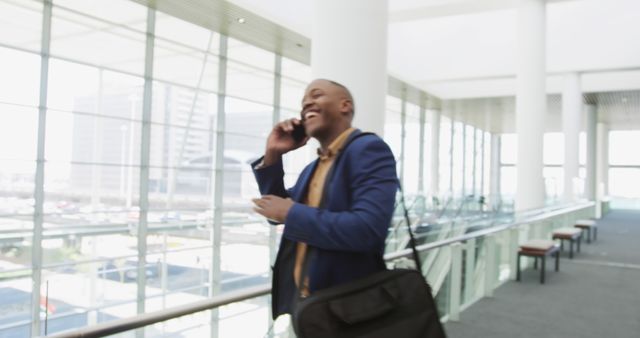 Cheerful Businessman Talking on Mobile in Modern Office Interior - Download Free Stock Images Pikwizard.com