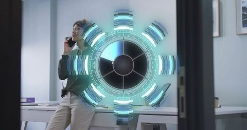 Leaning professional talking on smartphone with holographic futuristic ui in modern office