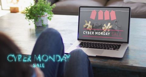 Woman Shopping Online on Cyber Monday Using Laptop