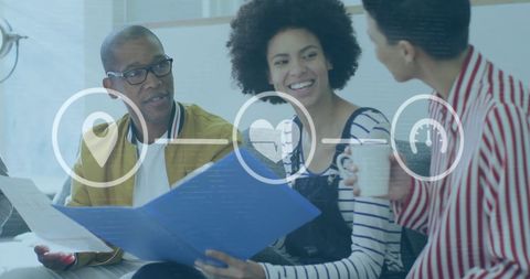 Diverse Business Team Engaging with Digital Overlay in Modern Office