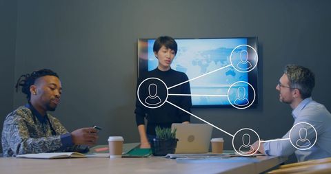 Colleagues Discussing with Digital Network Overlay in Office Setting