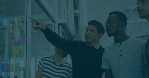 Team Collaborating in Modern Office Workspace on Idea Development