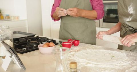 Family Baking Session in Modern Kitchen Highlighting Teamwork