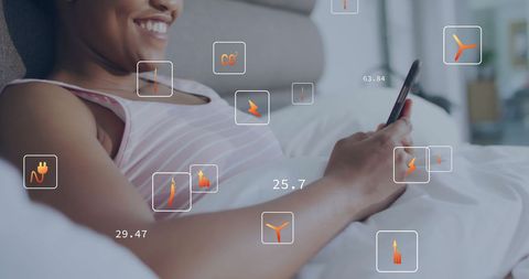 Woman Using Smartphone with Eco Symbols and Energy Metrics Overlay