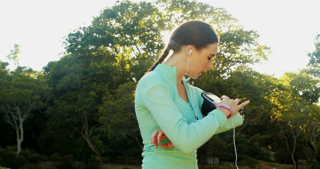 Female Athlete Checking Smartwatch During Outdoor Workout - Download Free Stock Images Pikwizard.com