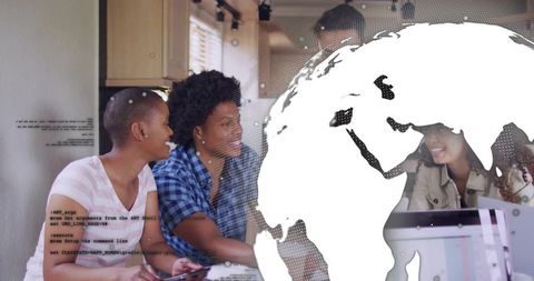 Diverse startup team collaborating around table with laptop and globe overlay