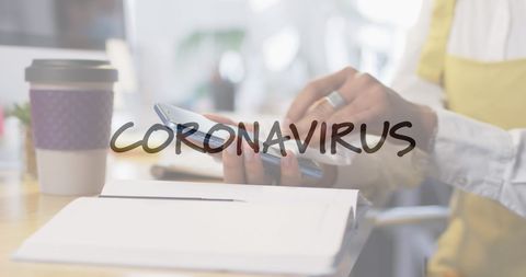 woman disinfecting smartphone in office during covid-19 pandemic - Download Free Stock Images Pikwizard.com